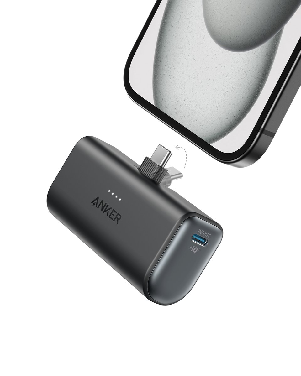 Black Anker Nano 5K power bank with its USB-C plug folded out toward the bottom of a phone