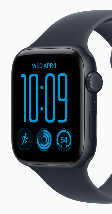Midnight aluminum Apple Watch SE 3 face-on with a Midnight sport band, the screen showing WED APR 1, 10:09 and three complications including activity rings, on a white background