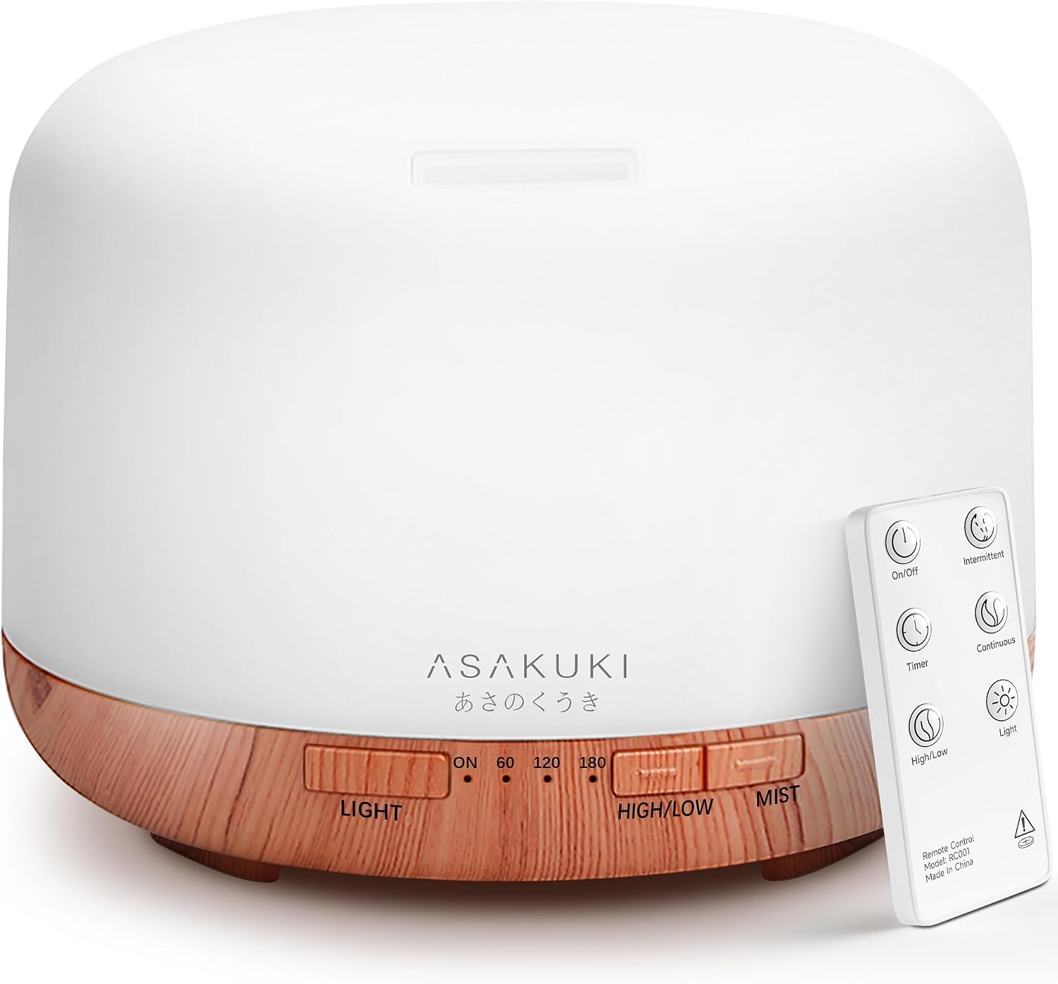 ASAKUKI 500ml diffuser in the Yellow finish, a white rounded tank with the ASAKUKI wordmark on a light wood-grain base, its white RC001 remote standing beside the unit