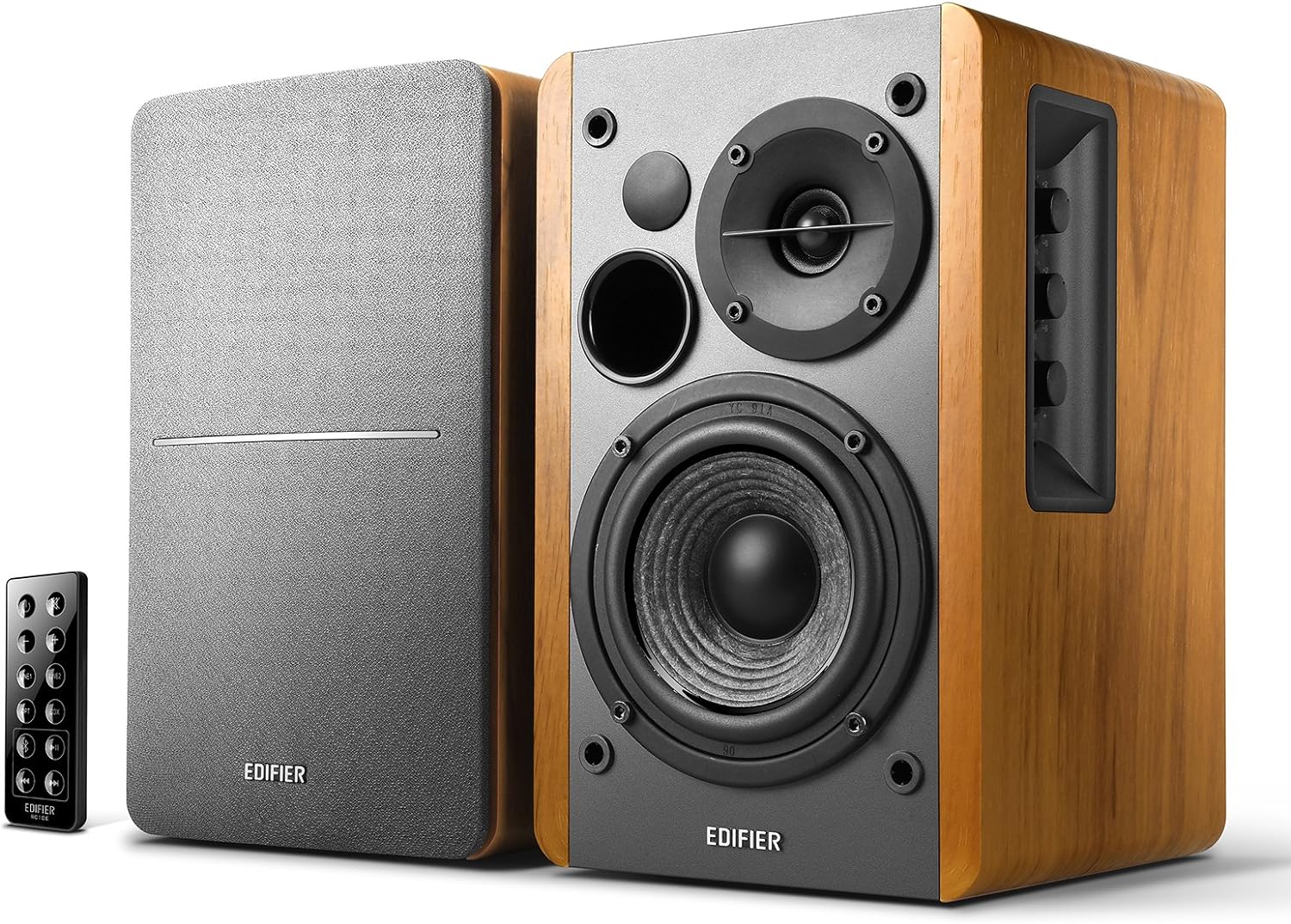 Edifier R1280DB powered bookshelf speakers in the wood-grain finish — gray driver baffles, one cabinet's rear panel showing bass, treble, and volume knobs, the slim remote beside the pair, on a plain white background