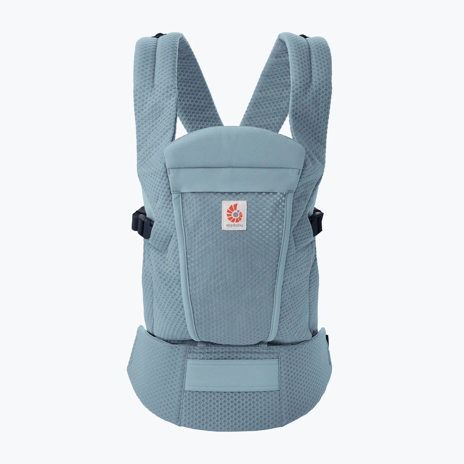 A slate blue Ergobaby Omni Lite carrier laid out flat on a pale background: a slate blue mesh body with a smooth fabric head-support panel at the top, two padded mesh shoulder straps rising behind it, a dark buckle on each side, a wide mesh waist belt with a smooth rectangular panel at its center, and the square white Ergobaby logo patch stitched on the center panel