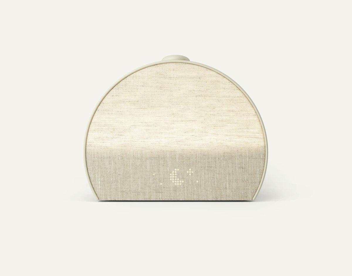 Hatch Restore 3 in Putty, front view, showing the linen-textured face and dot-matrix clock