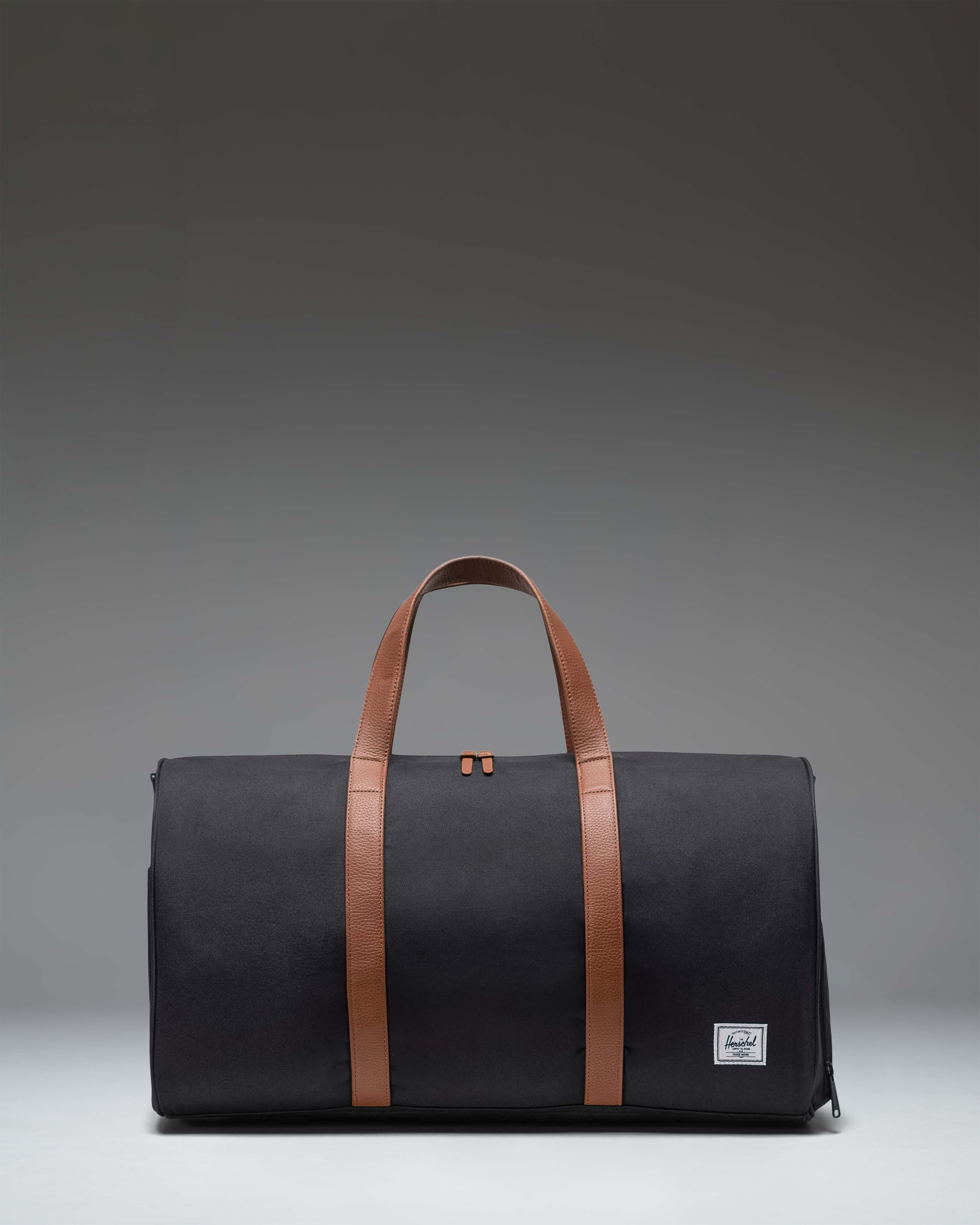 Black Herschel Novel Duffle with a shoulder strap
