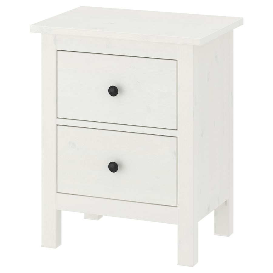 White HEMNES two-drawer chest of drawers in solid pine with black knobs, standing on four legs