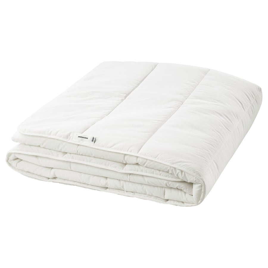 IKEA SMÅSPORRE white comforter folded to show the smooth shell and edge stitching