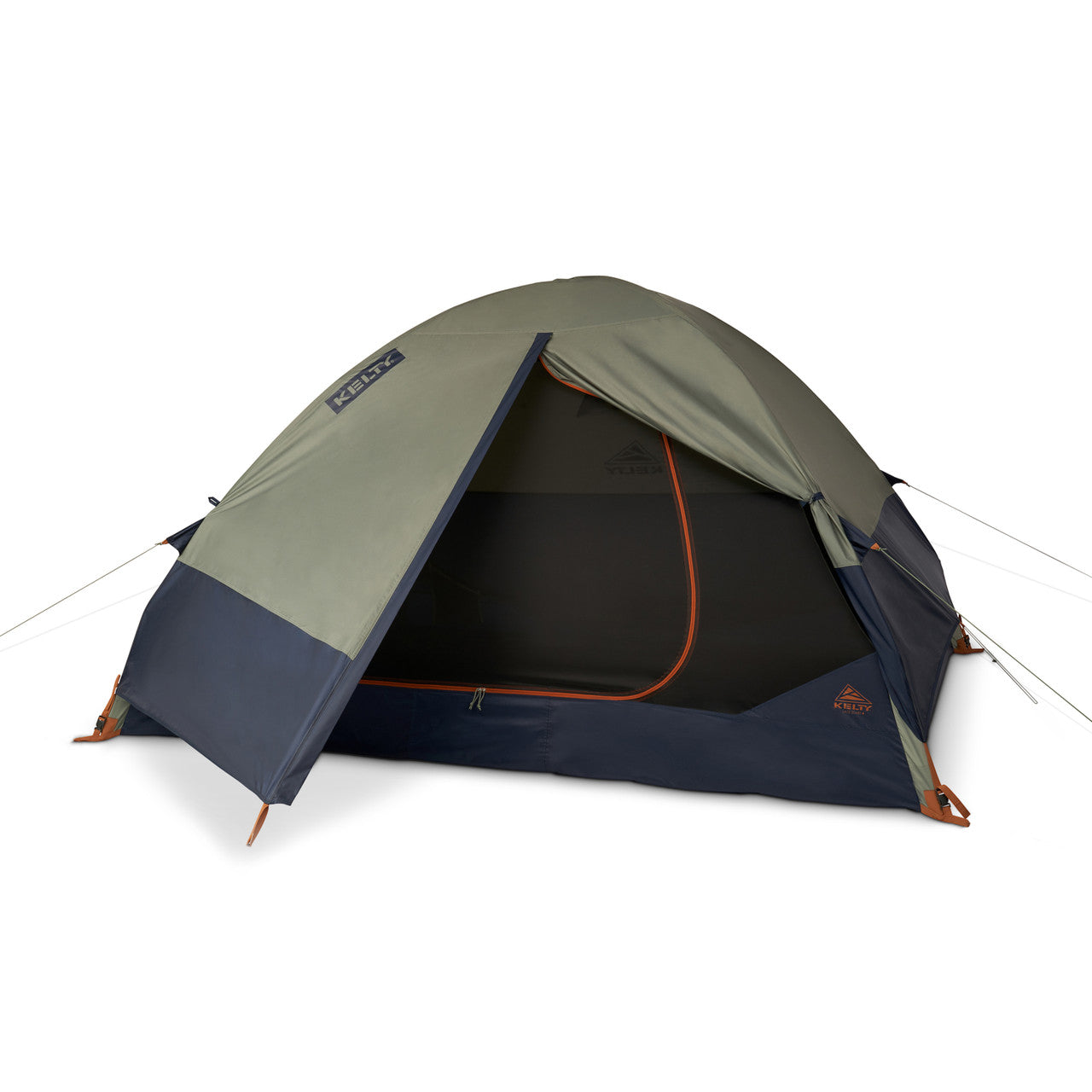 A pitched dome tent photographed from the front left on a plain white background, with a sage-olive upper fly, a white KELTY wordmark printed on a dark navy rectangular patch at the left of the fly, a dark navy lower panel and floor rim, an open door edged with a bright orange zipper, black No-See-Um mesh visible through the doorway with a faint dark Kelty triangle printed on it, a small orange KELTY triangle badge on the lower right navy panel, orange guy-line anchors and hooks where the lines meet the ground on both sides, thin pale guy lines running out to the left and right, and a soft shadow beneath the tent