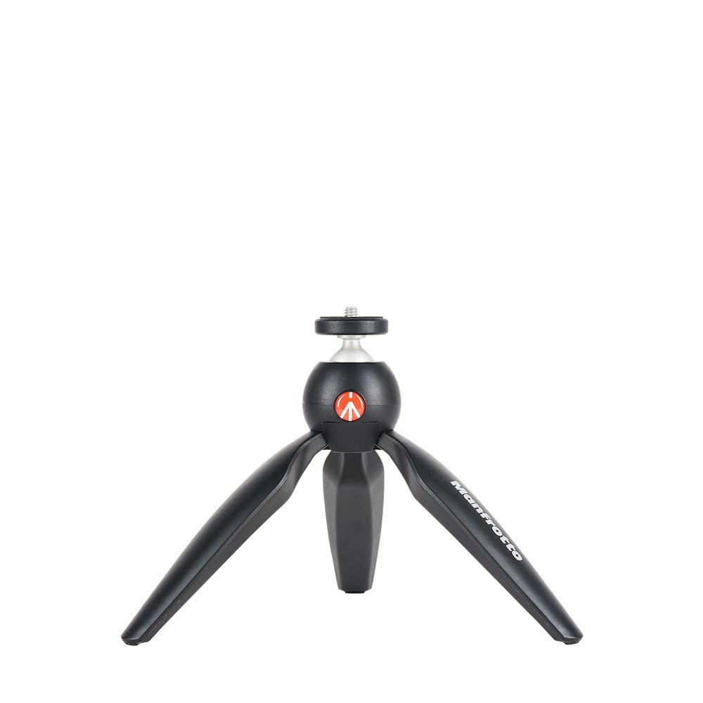 Black Manfrotto PIXI mini tripod with legs open and the push-button ball head facing forward