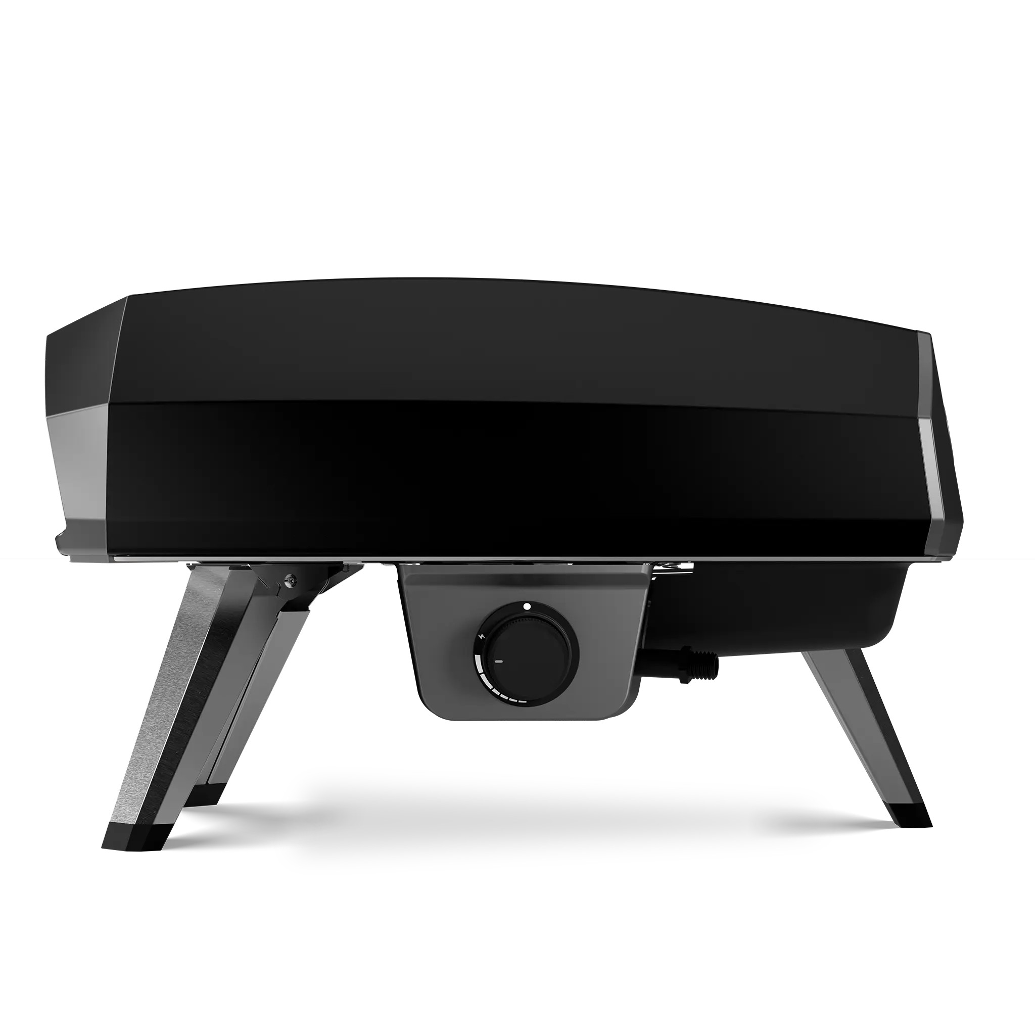Ooni Koda 2 gas pizza oven in black, side view on a white background: domed black body with gray end panels, a gray control housing under the body carrying a black dial with a white index dot and a white tick arc, a short black threaded gas inlet stub to the right of that housing, and gray legs with black feet, two of them on the left of the frame