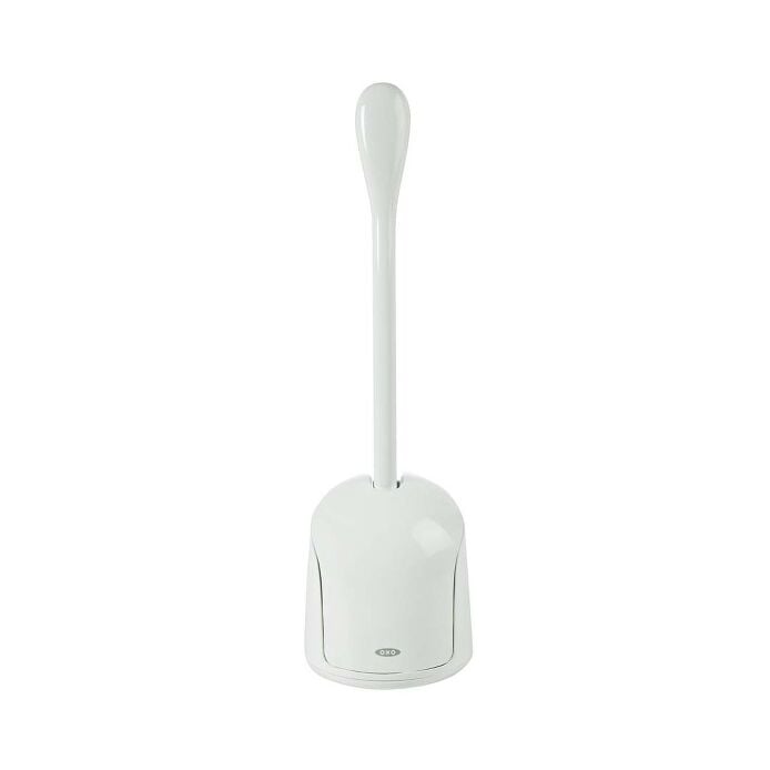 White OXO Good Grips compact toilet brush standing in its closed canister