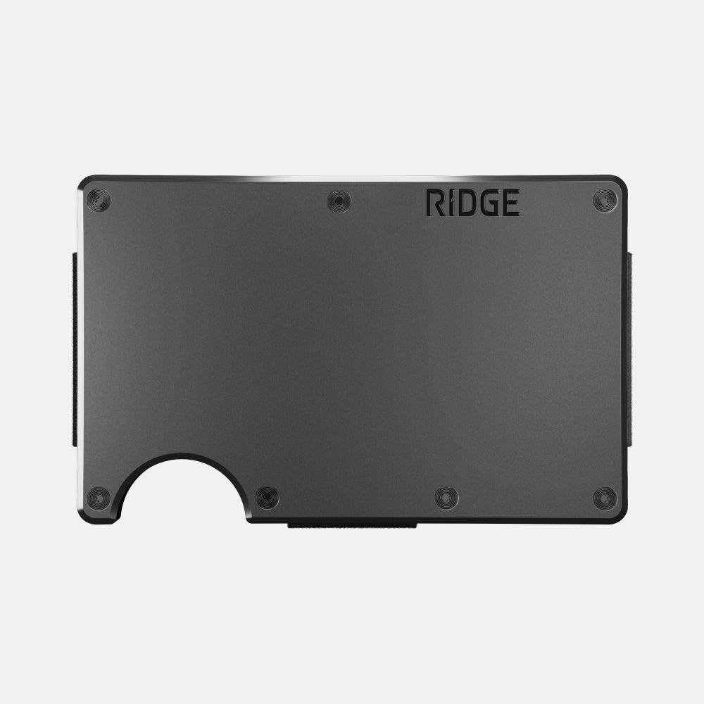 Gunmetal Ridge Wallet aluminum card holder, front plate with the Ridge logo