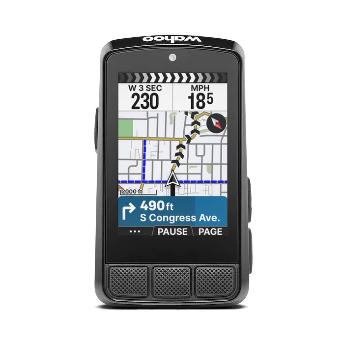 Wahoo ELEMNT BOLT 3 GPS bike computer in black, front view on a white background, with the lowercase wahoo wordmark on the top edge, three mesh-textured buttons across the bottom face, and the color screen showing a street map with a route line, 230 and 18.5 MPH data fields, and a 490 ft S Congress Ave. turn prompt