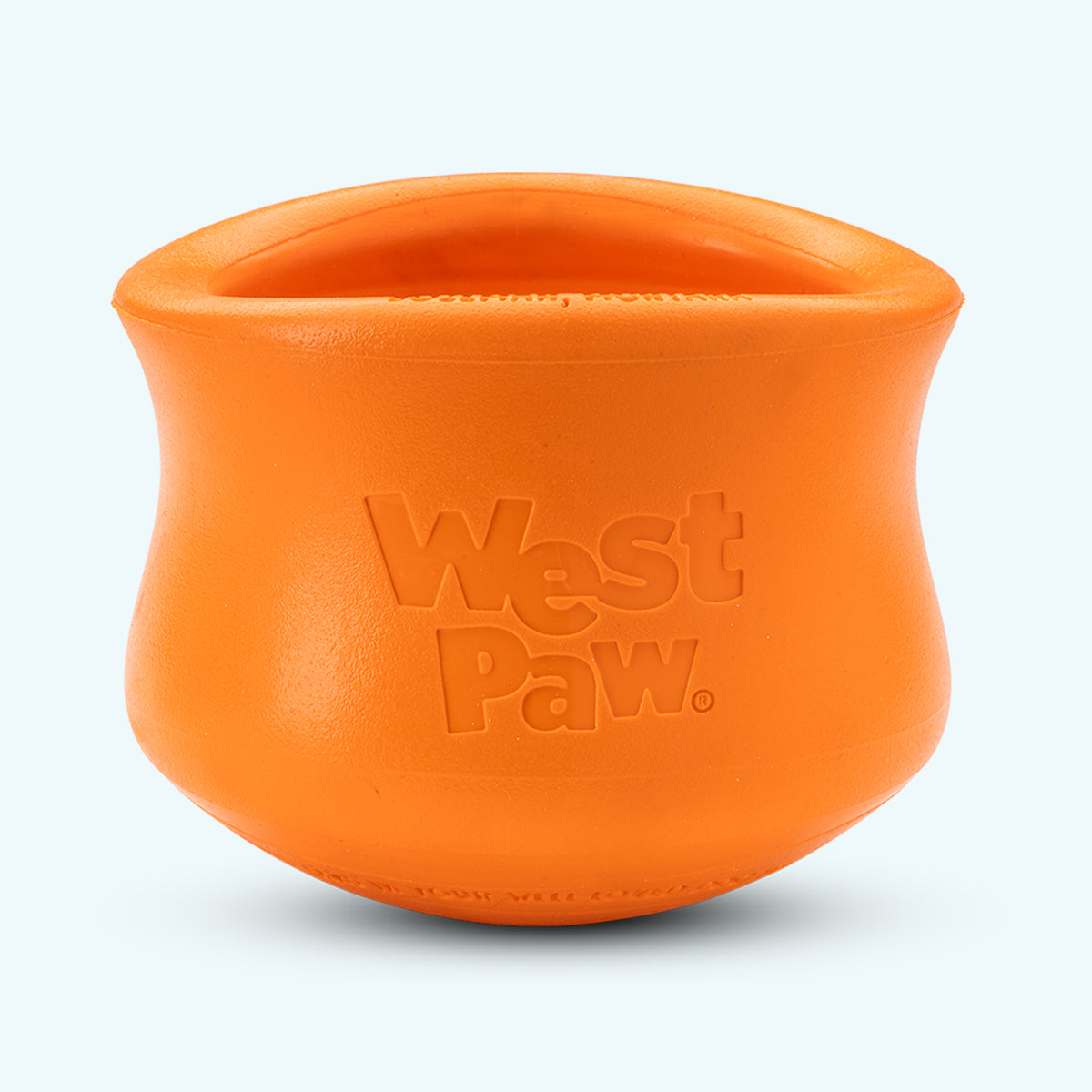 Orange West Paw Toppl treat toy standing upright, showing the wide opening and rounded inner teeth