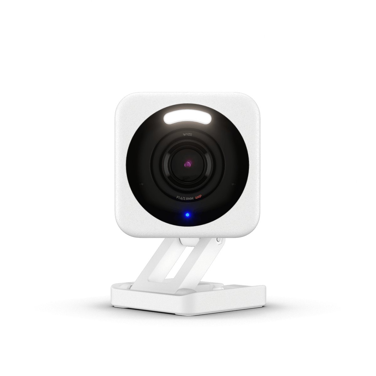 White Wyze Cam v4 on its folding stand, lens facing forward with the spotlight LEDs above it